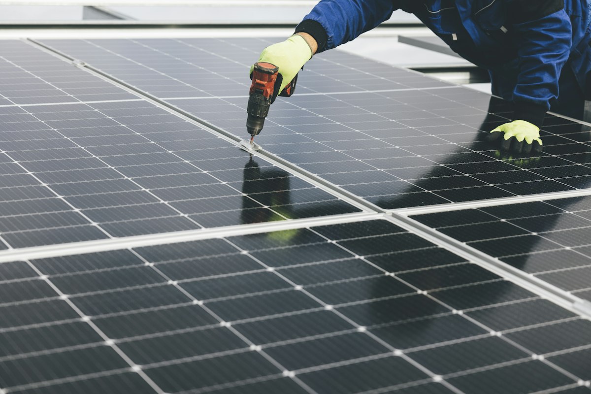 Technician working on a solar panel